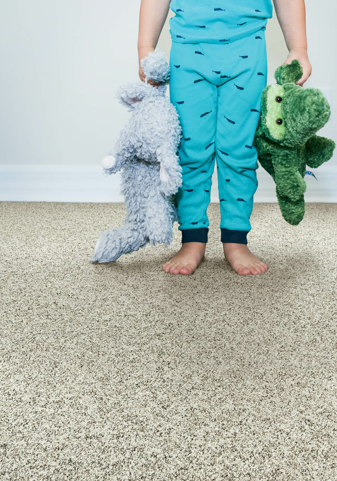Kids with toys standing on carpet | Floor to Ceiling Ottumwa